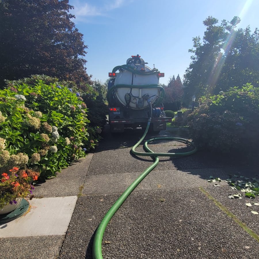 Septic pumping truck prepared for service.